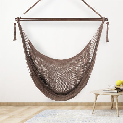 Mocha Large Caribbean Hammock Chair hanging indoors beside a small round side table against a cream wall