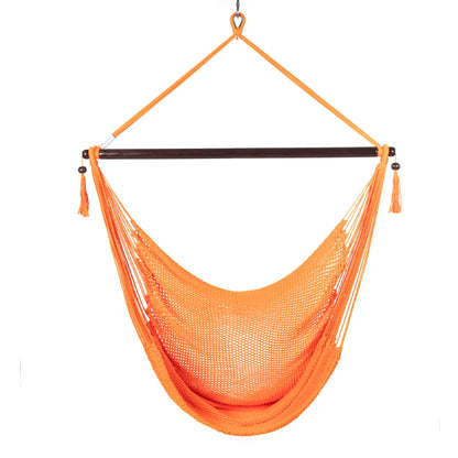 Front view of an orange Large Caribbean Hammock Chair showing the deep woven seat and built-in footrest, on a white background