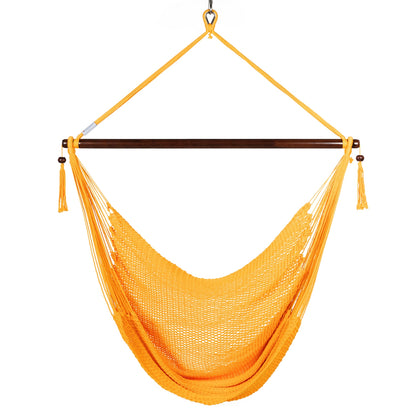 Front view of a yellow Large Caribbean Hammock Chair showing the deep woven seat and built-in footrest, on a white background